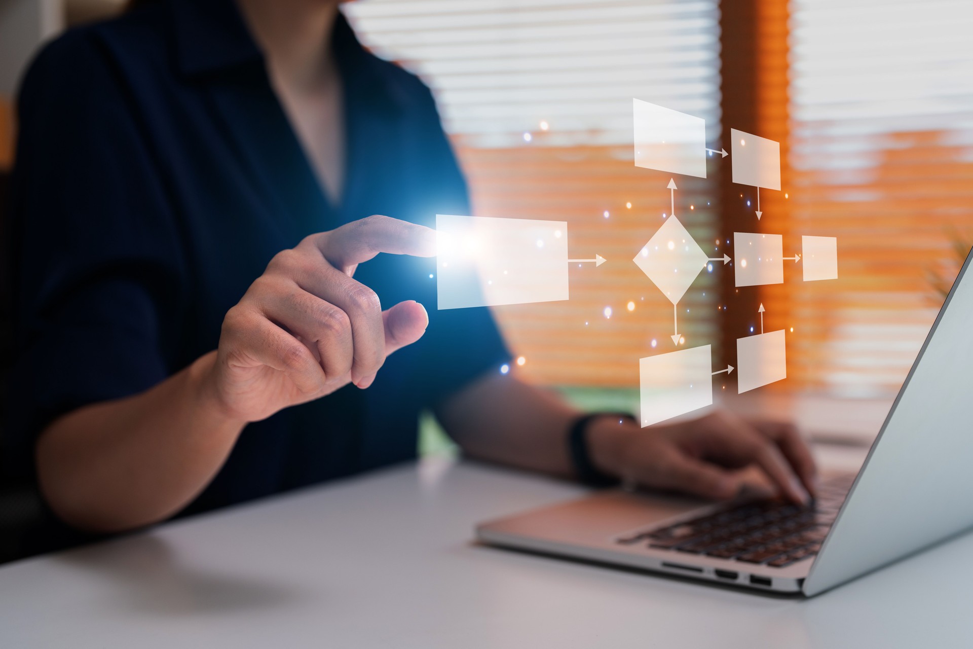 Businessman using a computer analysis for process and workflow automation with flowchart